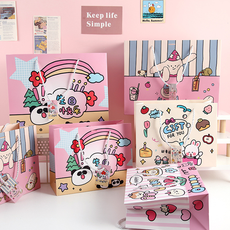 Bolsas de regalo de dibujos animados en bolsas de regalo de mano de tarjeta blanca bolsas de regalo de mano de estudiantes bolsas de regalo de mano