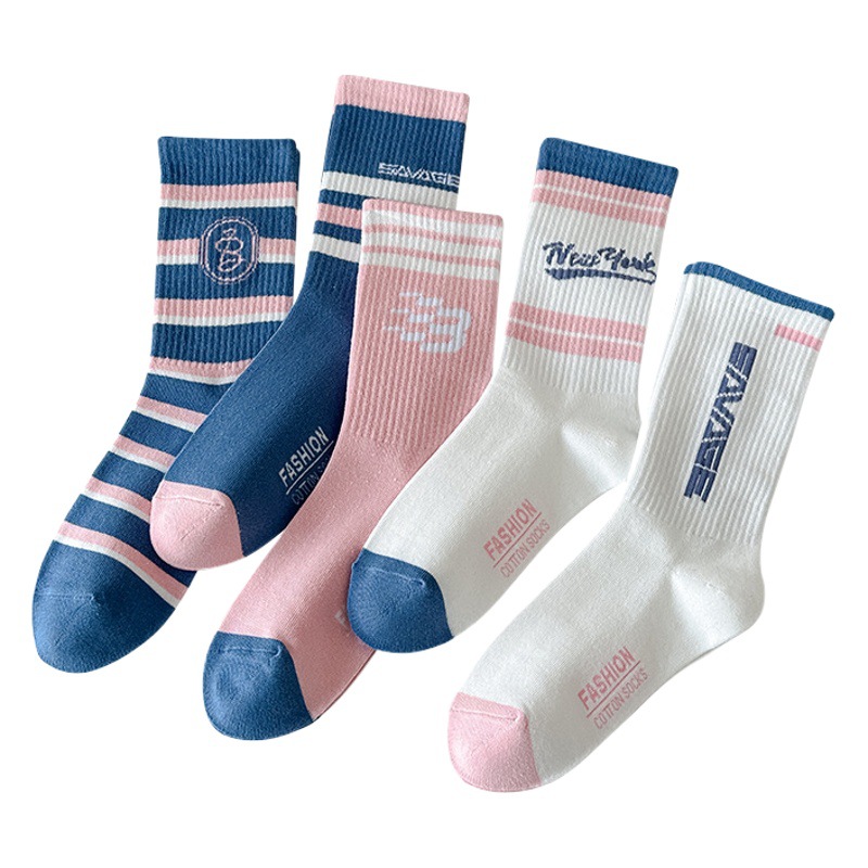 Calcetines de algodón de color puro Otoño e Invierno carta de mujer a rayas ins calcetines de media pantorrilla de moda calcetines deportivos elásticos altos al por mayor