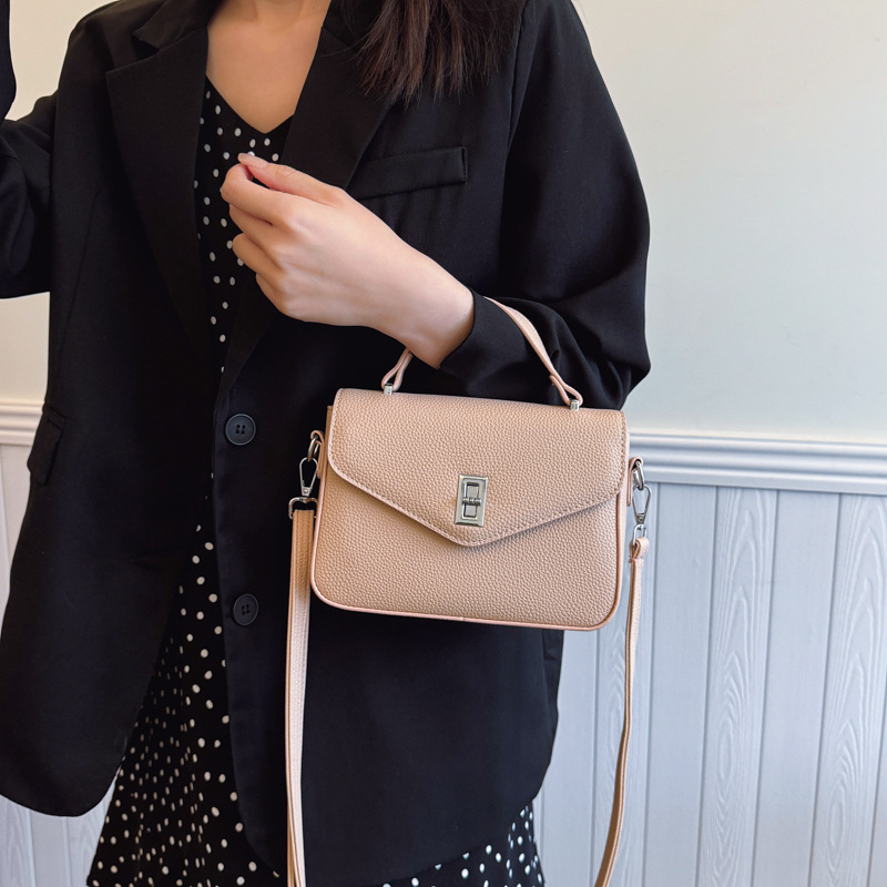 Bolso de moda coreano 2025 primavera y verano nuevo bolso femenino casual con patrón de lichi bolso de hombro simple bolso de mensajero de viaje