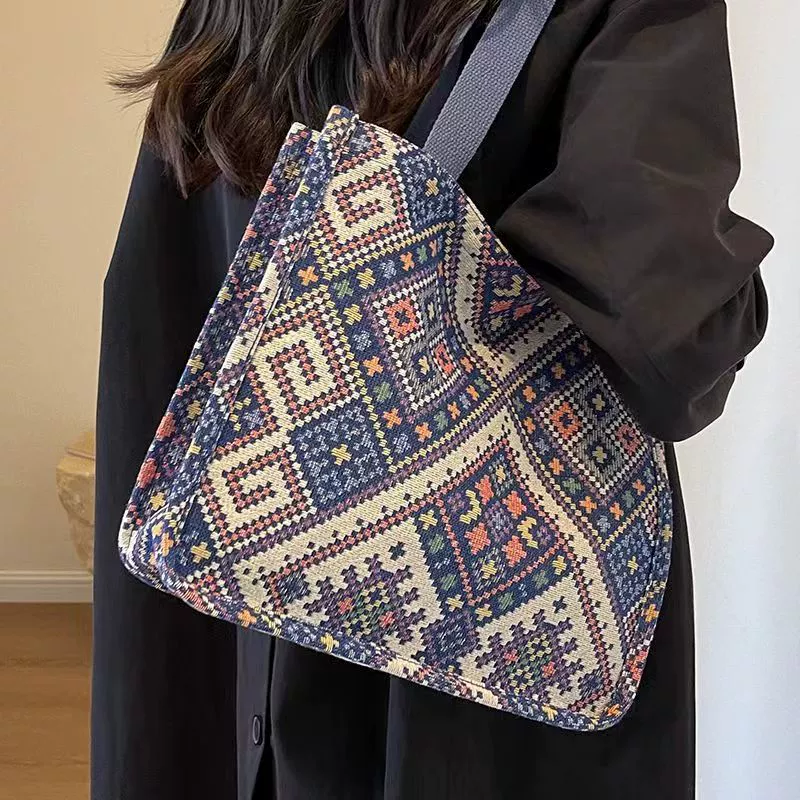 Capacious ethnic one-shoulder bag for students - woven geometric pattern, adjustable strap, blue