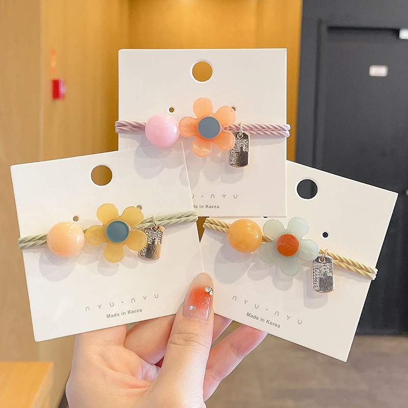 Japonés y coreano Super Hada red cabeza roja cuerda flor redonda banda de goma simple todo-fósforo de la moda de alta apariencia linda chica horquilla