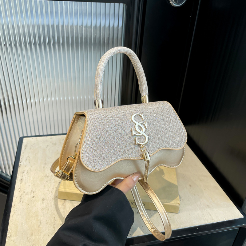 Bolsos cuadrados pequeños portátiles casuales Bolsos pequeños retro de moda para mujer 2025 primavera nueva moda casual popular bolso de mensajero