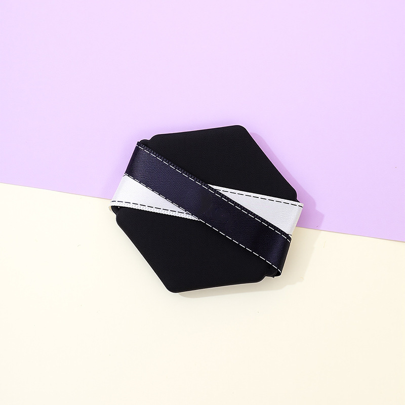 La borla de polvo de cinta de dos colores personalizada de fábrica no come polvo, gotas de agua sin látex, esponja de maquillaje de seis lados en forma de diamante, cojín de aire al por mayor