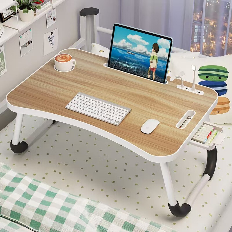 ベッドの上で小さなテーブルを折りたたみます。多機能携帯机です。|undefined