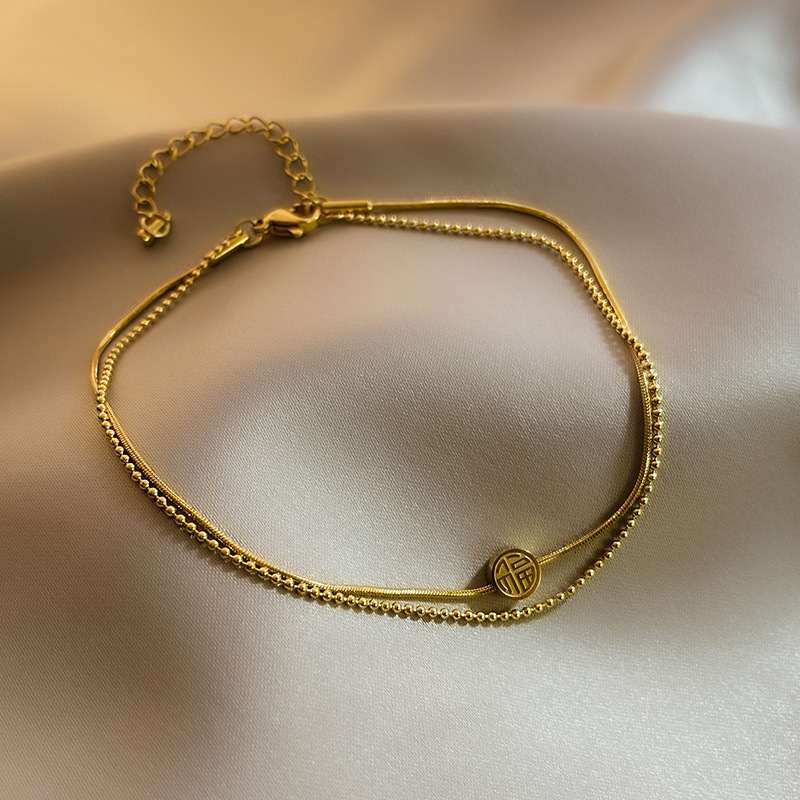 Fuzi doble tobillera sexy femenina versión coreana simple Mori tobillera desnuda personalidad titanio cadena de pie de acero temperamento tobillera neto