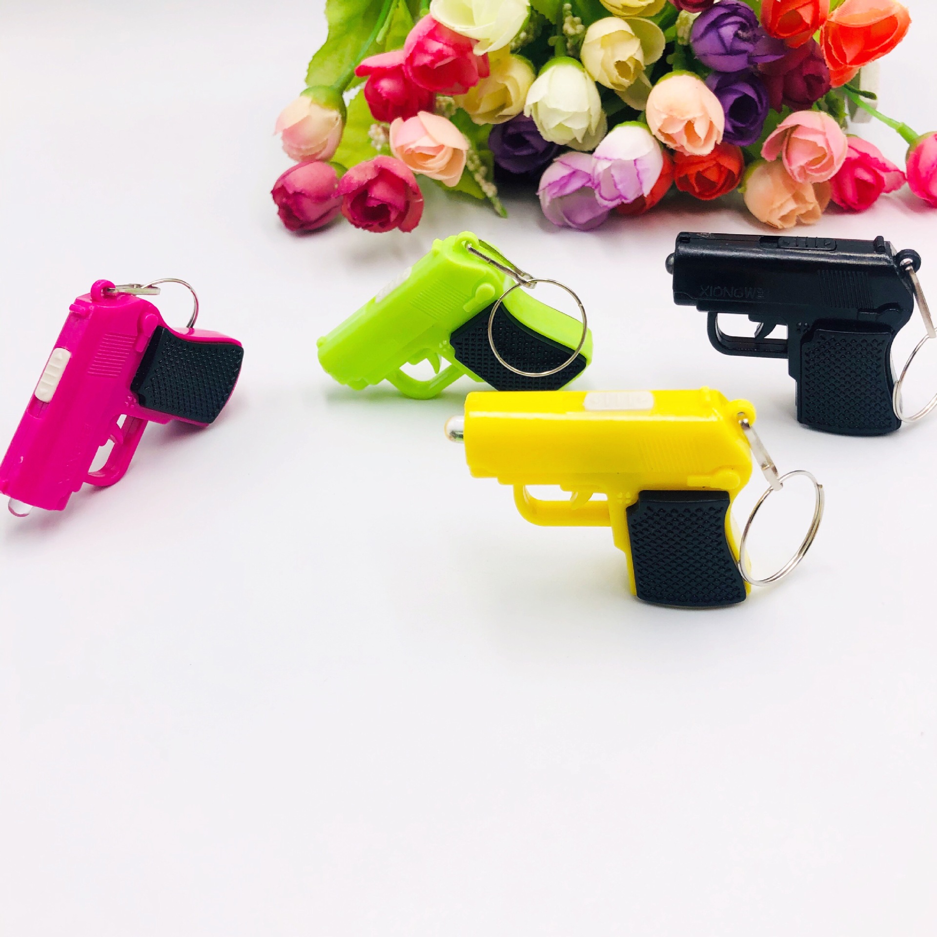 Pistola llavero luminoso colgante LED llavero juguete luminoso de los niños creativo pequeño regalo