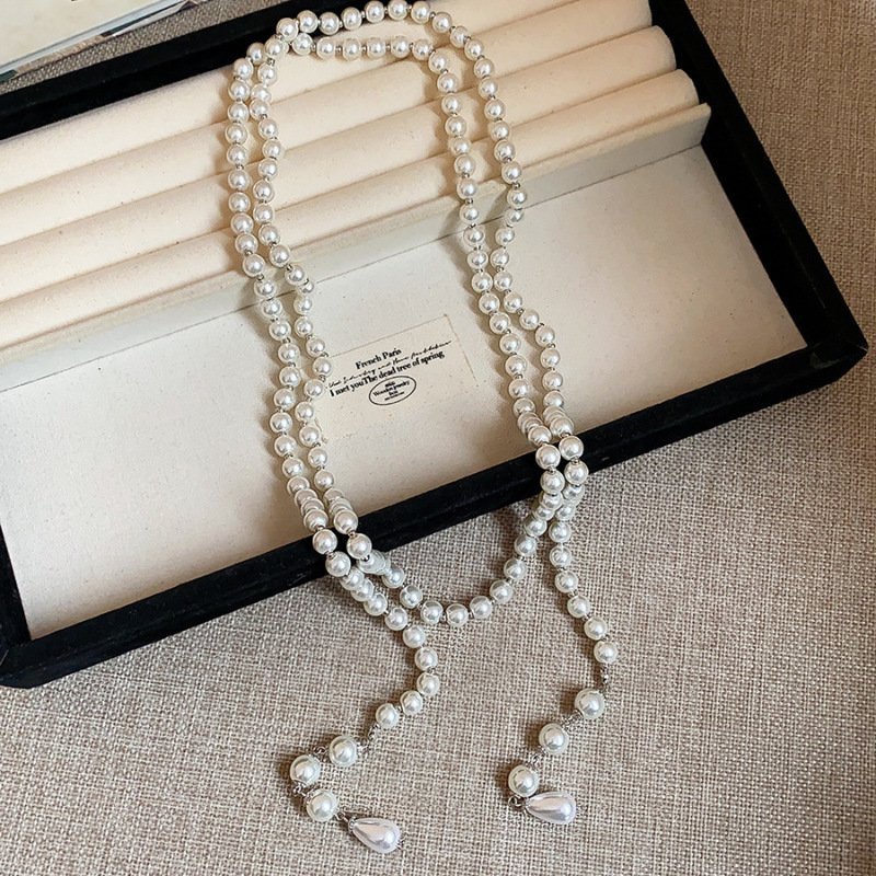 不規則な長いタイプの真珠のネックレスのフランス式の軽い豪華な気質のセーターのチェーンの小さい大衆のシンプルで高級感の項は卸売りの女性を飾ります。