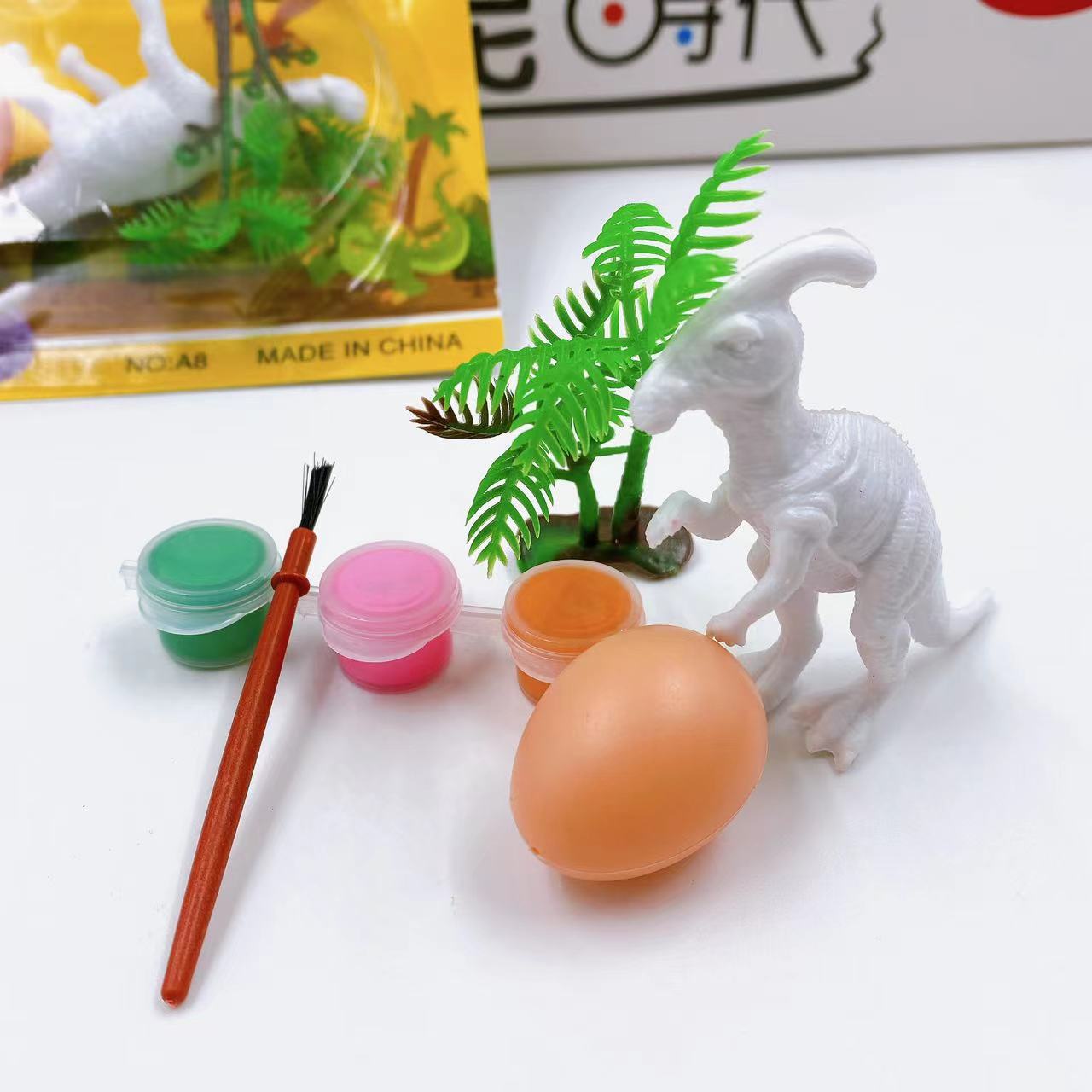 Dinosaurio DIY pintado graffiti pintado a mano relleno de color muñeca de jardín de infantes para niños no yeso blanco 2 yuanes lotes de departamentos