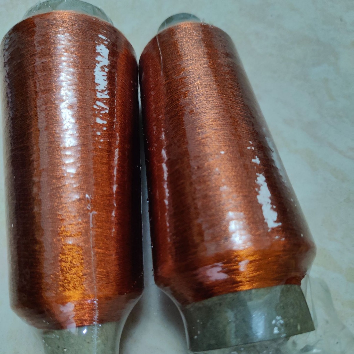 100D黑色涤纶股包金纸线车缝面料包银纸刺绣用线包黑色亮纸刺绣线