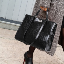 真皮包包女士2025新款大容量托特包百搭黑色手提通勤女包单肩大包