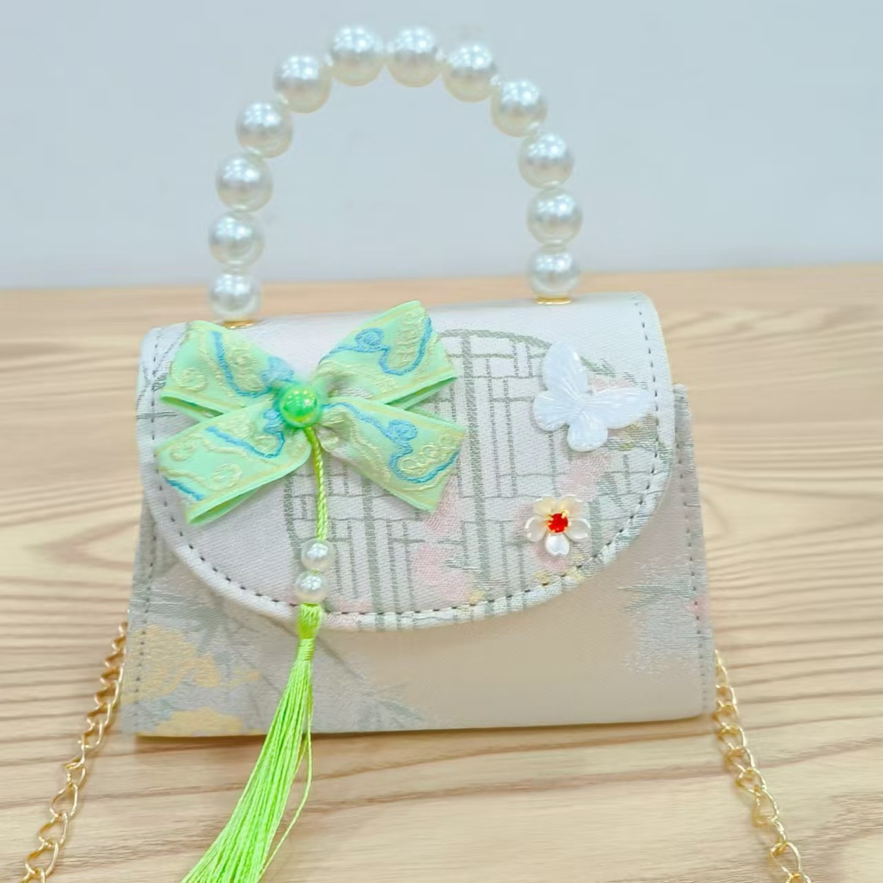 202 nuevo arco de estilo nacional bolsos para niños pequeños bolsos de moda de perlas de moda princesa bolsos de mano inclinados