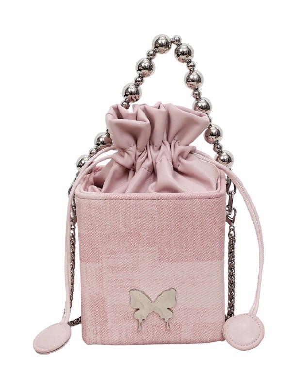 Bolso de cadena de perlas portátil para mujeres 2026 nuevo estilo coreano de nicho de cuerda de tirón sellado de moda de hombro mochila