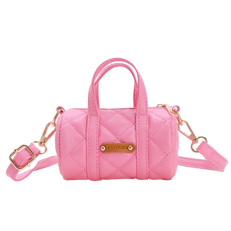 Bolsas infantiles simples de color sólido, bolsas de mini barril de moda coreana, 2025 nuevas bolsas para bebés de comercio exterior