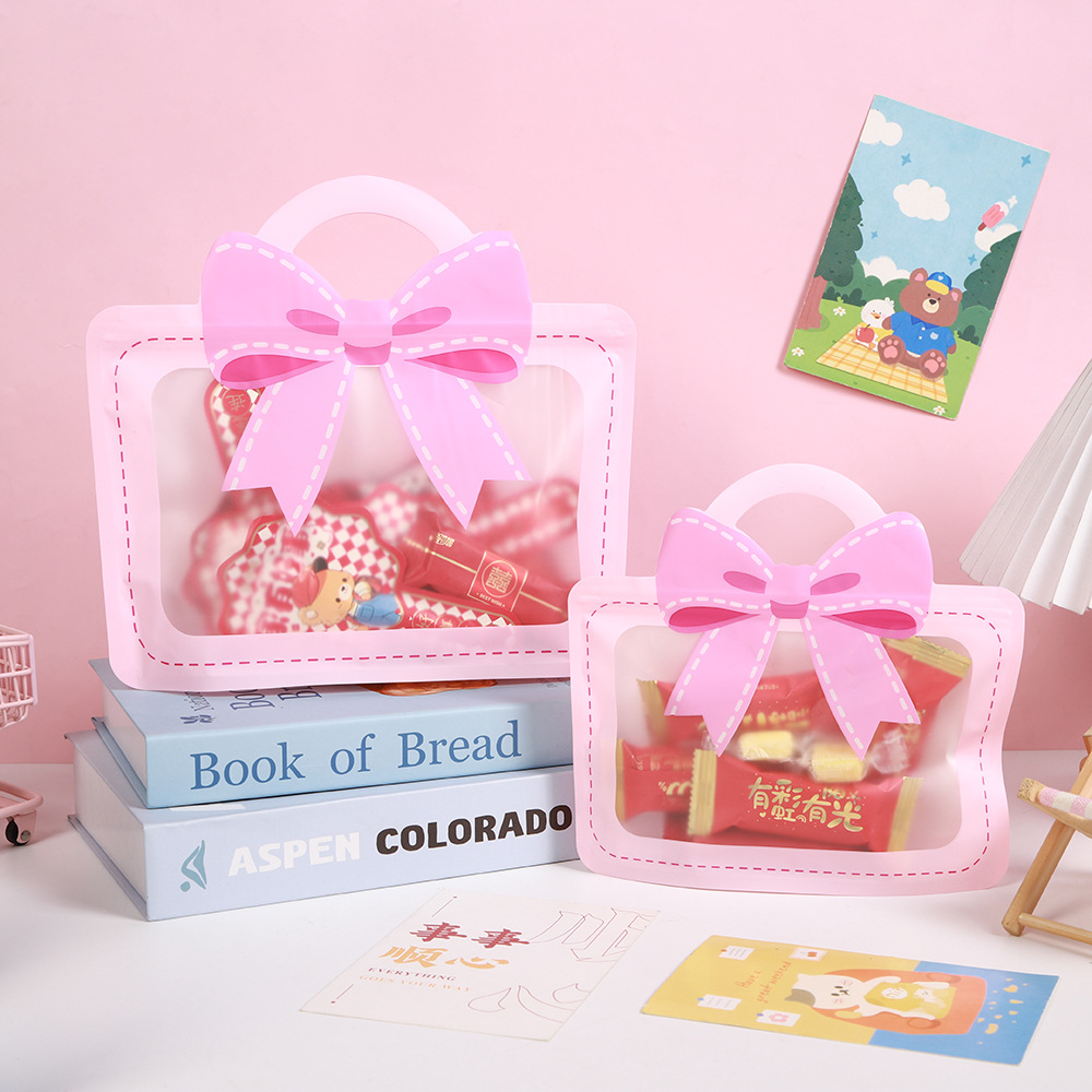 El fabricante personaliza la bolsa de regalo de cumpleaños del jardín de infantes, la bolsa de regalo de mano, la bolsa de dibujos animados y la bolsa de embalaje de lazo de varias especificaciones.