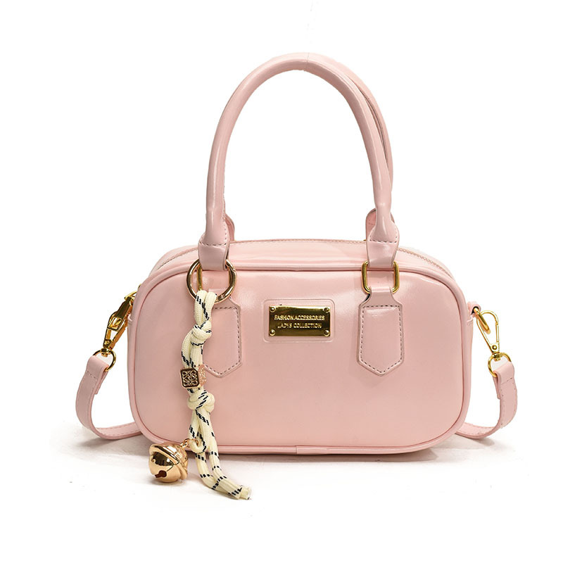 Bolsa de bolos de mano caliente para mujeres 2025, nueva bolsa de hombro simple de moda popular, bolso de mochila de estilo extranjero