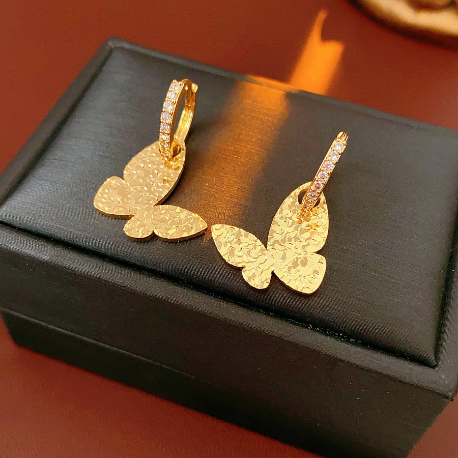 Aguja de plata MEDIADOS DE-antigua flor redonda borla pendientes de metal retro europeo y americano elegante luz pendientes de lujo al por mayor para las mujeres