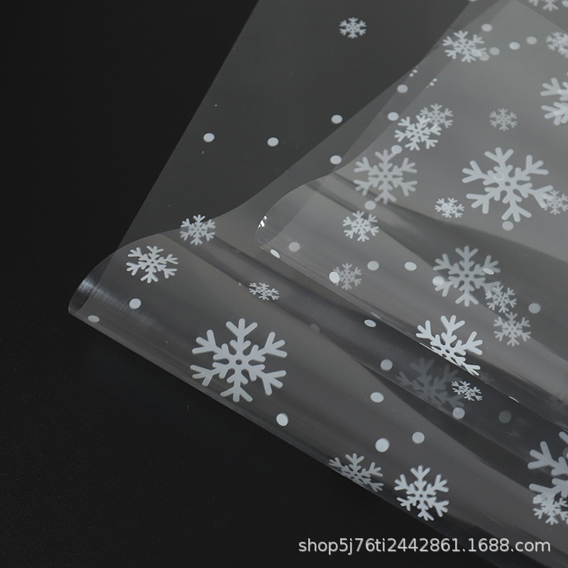 雪花玻璃纸圣诞节花束包装纸苹果平安果包装雪花图案透明纸批发