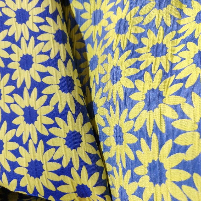 厂家现货蓝黄撞色太阳花葵花几何色织提花布料男女童装鞋包面料