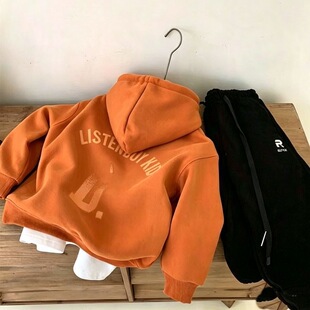 Orange hoody, black comfortable trend fashionable trousers