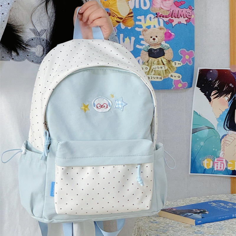 Polka dot color blocking cartoon star embroidered backpack, lightweight nylon schoolbag, suitable for junior and senior high school students.