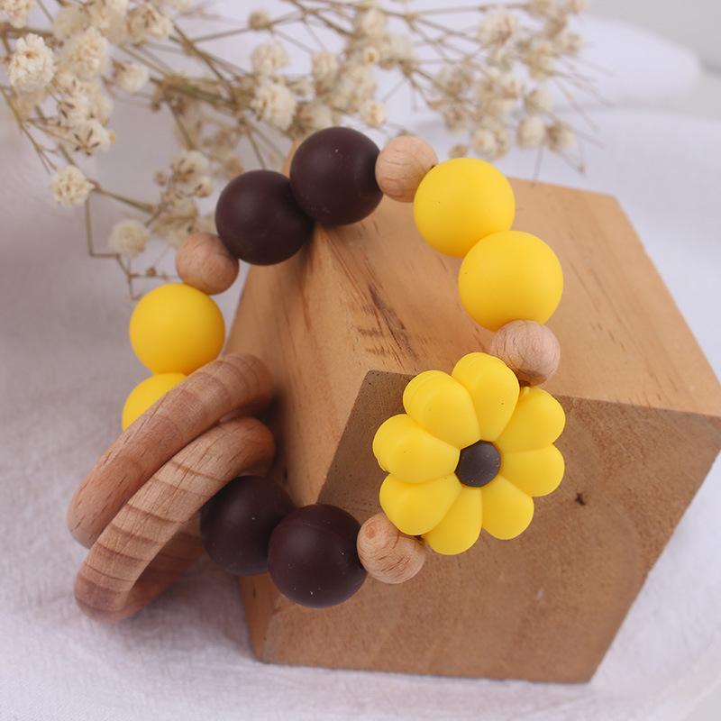 Nuevo juguete de mano para bebé con sonajero, los molares de los niños pueden morder el castaño de haya, margarita, pulsera de flores, mordedor