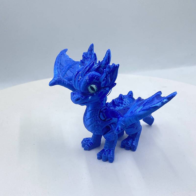 3Dプリントされたかわいい西洋のドラゴンの羽と尾は縮めたり動かしたりできる関節が付いており、子供向けのギフト、おもちゃ、モデルの装飾品です。|undefined