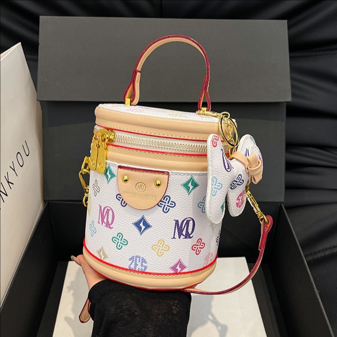 Bolso de cubo portátil con costuras de impresión retro transfronterizo para mujer 2025 nueva moda presbiteriana bolso de mensajero de un solo hombro para mujer