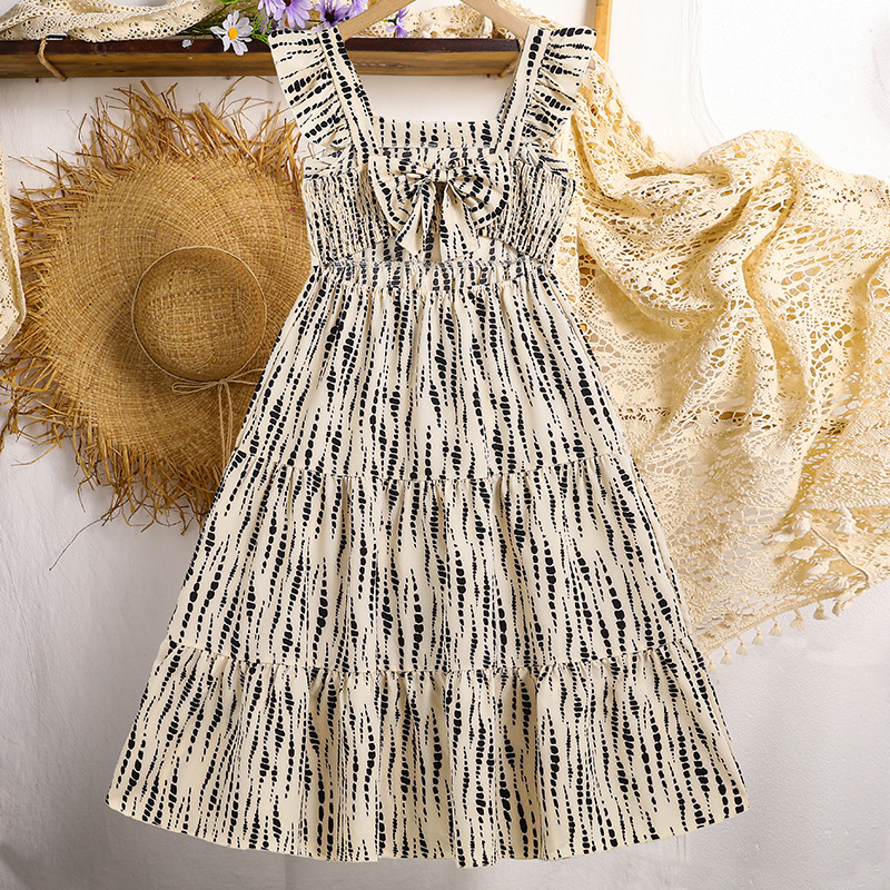 Ropa de niña transfronteriza 2025 primavera y verano nuevo estilo vestido de tirantes estilo de vacaciones europeo y americano falda larga con estampado de rayas irregulares