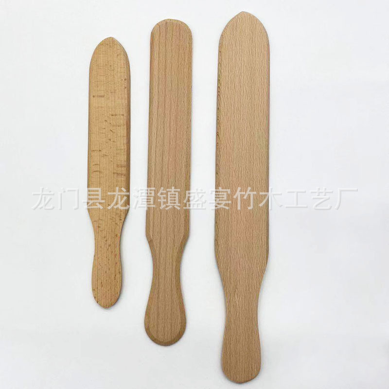 卵焼きの木の熊手の果実の屋台のパンケーキの木の熊手の木の押し棒の木のシャベルの卵の餅の屋台のパンケーキは押します。|undefined
