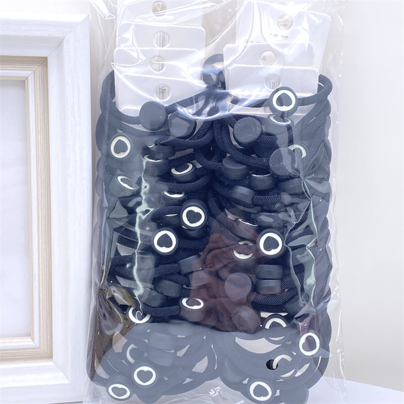 Nuevo hilo amor diamante tarjeta pelo anillo cadena Smiley oso etiqueta de cuero supermercado 2 yuanes tienda accesorios para el cabello cabeza Accesorios