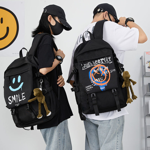 新韩版时尚电脑背包初高中大学生书包大容量笑脸男女双肩包情侣包