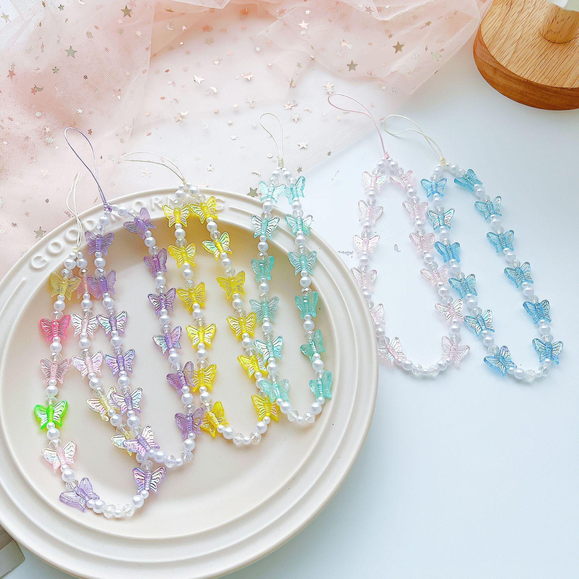 Nicho creativo DIY mariposa cuentas hechas a mano ins de la chica de viento a prueba de perder cadenas de teléfonos móviles CCD cuentas colgantes de la cámara