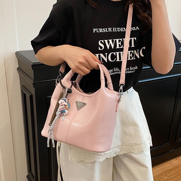 Bolsa de cubo de mano explosiva de comercio exterior para mujeres 2025 nueva moda bolsa de hombro ocio para viajar al trabajo de alta calidad bolsa madre