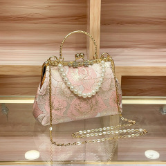 新製品の中国風のチャイナドレスはフランス式のミニの小さい女性のカバンを斜めに掛けて国の潮の美しい高品質のカバンの司藤を掛けます。
