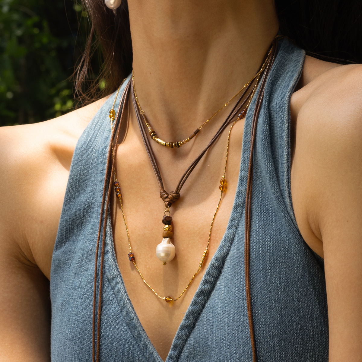 Collar de acero inoxidable TENA Europa y América de lujo ligero nicho largo collar de perlas de cuerda ligero lujo alto sentido de venta caliente transfronteriza