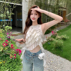 高品質の韓国系の気質の重工業のハスの葉の辺の婦人服の夏の新型は不規則な大衆のケーキの袖なしの上をつなぎ合わせます。