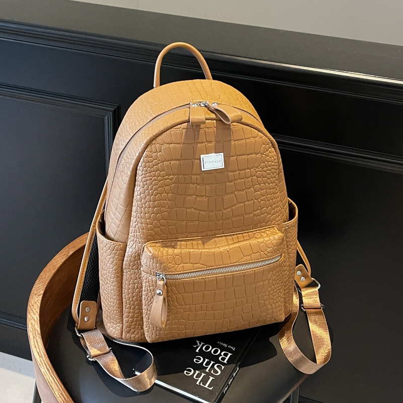 Moda coreana mochila de cuero suave para mujeres 2025 nuevo comercio exterior mochila de gran capacidad simple bolsa de viaje ligera