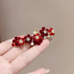 レトロな赤い花のトップクリップの髪の気質のバラの半は髪を刺します。