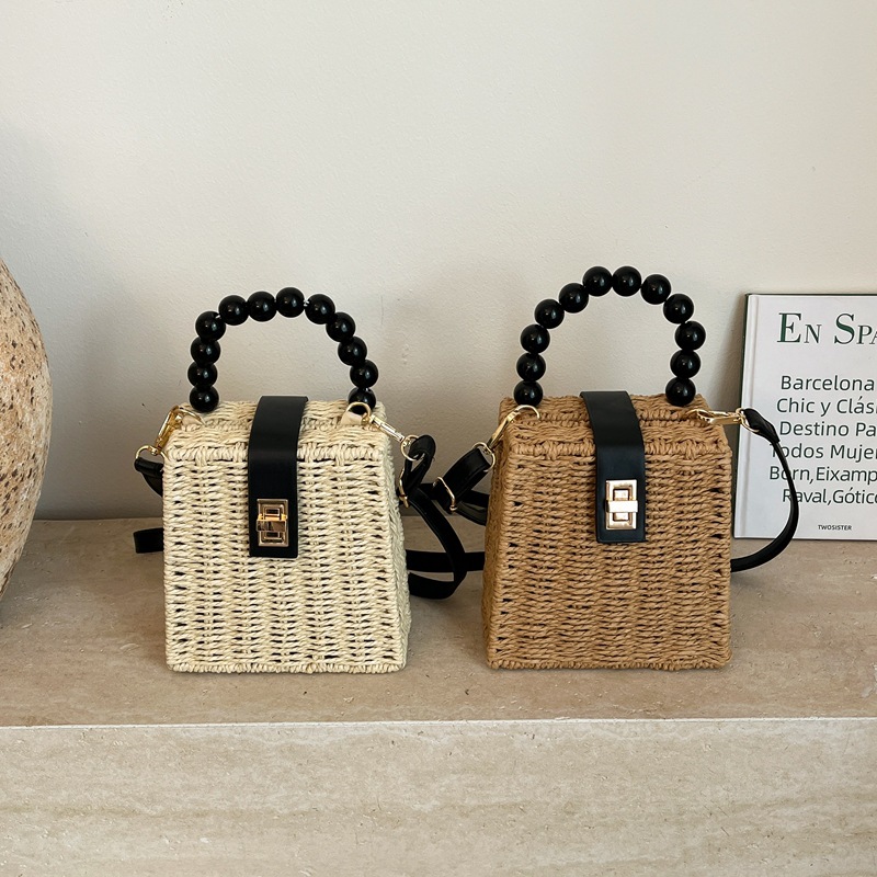 Bolsa de bambú de verano para mujeres 2026 nuevo cubo de caña bolso de tela de paja mini tela de tela portátil bolsa de tejido