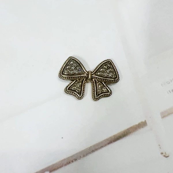 With bow, diamond encrusted