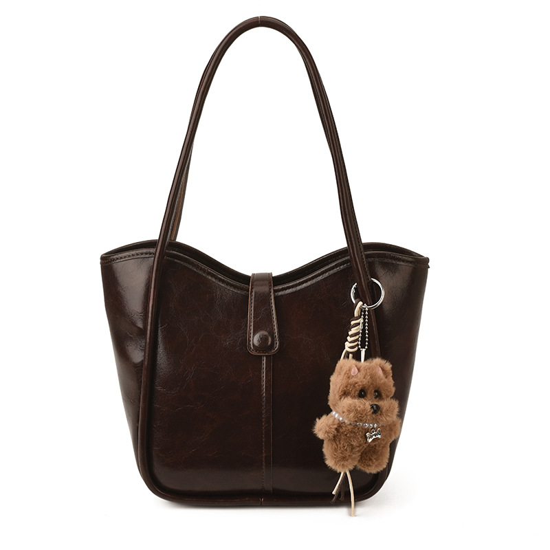 Este año, la moda simple bolso de cubo de mujer venta caliente nueva textura de alta calidad retro versátil lujo ligero bolso de hombro