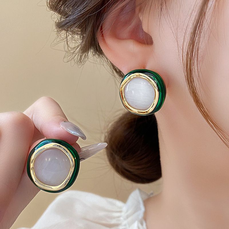Pendientes de camelia de simulación de aguja de plata Pendientes elegantes retro francés Pendientes de todo fósforo de moda personalizada