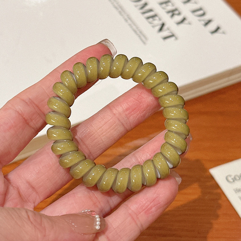キャンディー色の電話線の髪輪の女性は高弾力で長持ちします。|undefined
