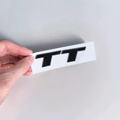 Car logo: TTS black lettering, center grille - standard-tt-font-glossy-black