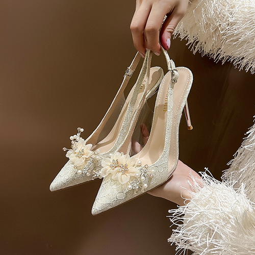 French-style golden bridal wedding shoes: stiletto heels with pointed toes, low-cut design, adorned with floral rhinestones, and featuring a chic open-toe back for women.