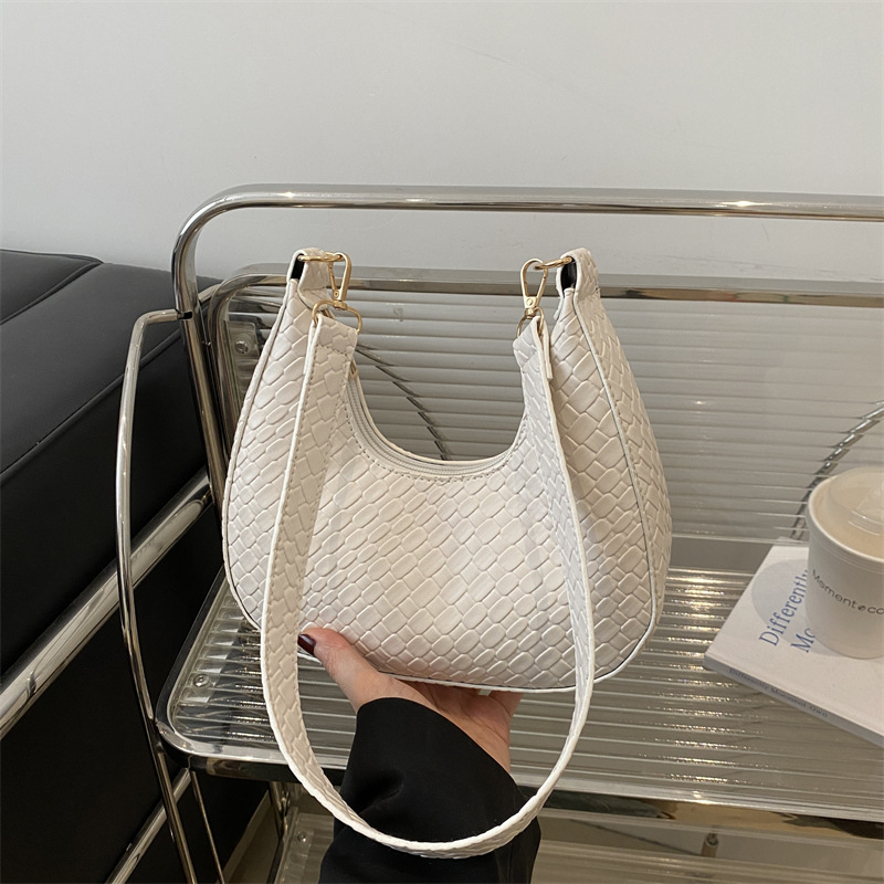 Bolsa de media luna francesa de tejido para mujeres 2025, primavera, nueva moda, textura de moda, bolso de hombro, elegante bolso de brazo