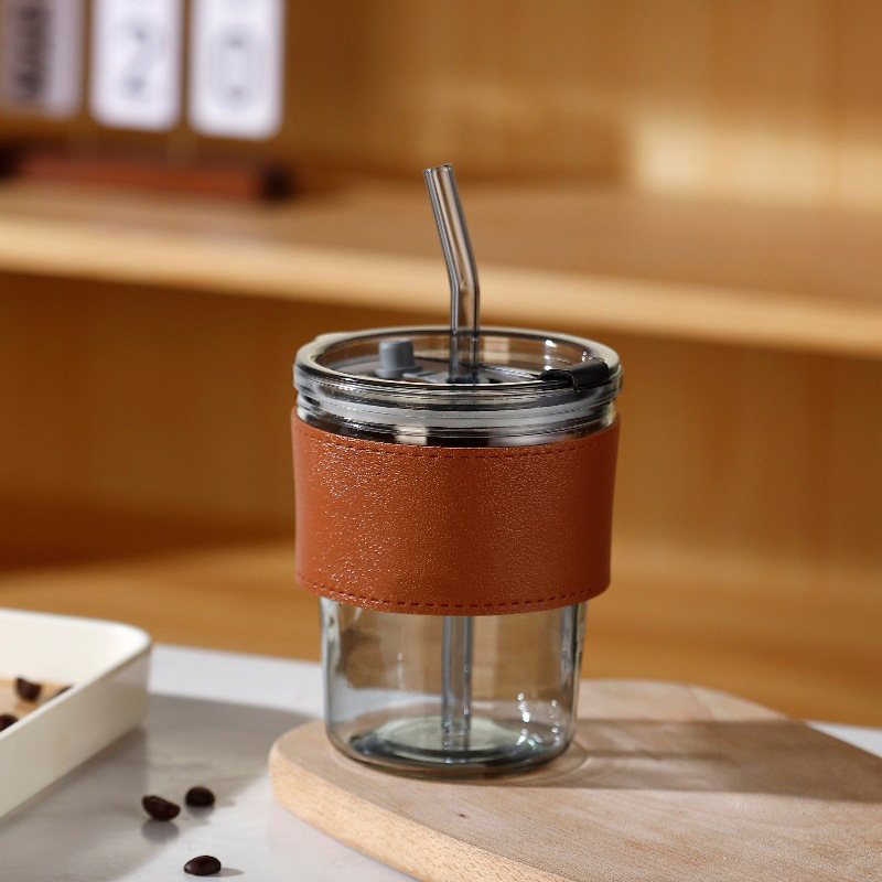 Tazas de vidrio de bambú en línea resistentes al calor tazas de paja de café ins viento alto valor de mano impresión de tazas de agua de regalo