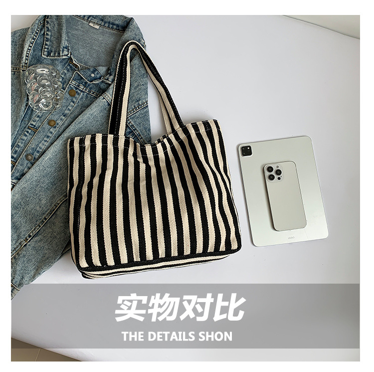 2024 Autumn/Winter new versatile and fashionable striped handbag shopping bag, two-tone large-capacity trendy single-shoulder bag undefined