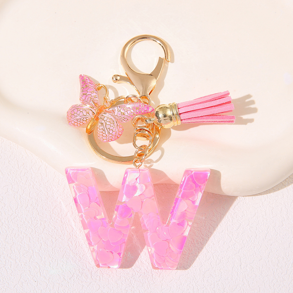 Nuevo rosa damas letras A-Z llavero de goteo de goma sequilla amor letras bordas mariposa llavero transfronterizo