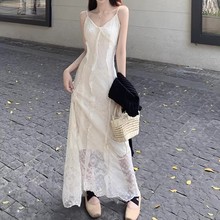 法式杏色V领蕾丝吊带连衣裙女2025夏季新款高腰a字海边度假风长裙